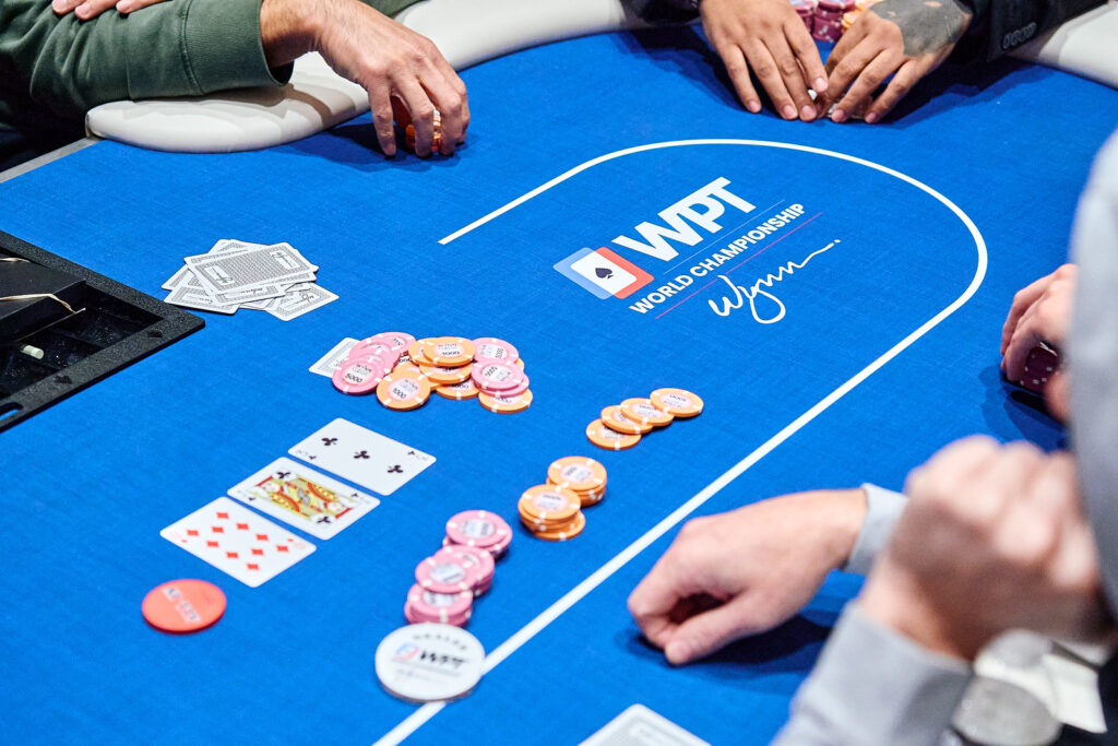 Poker table with chips and community cards at a WPT event — Photo: World Poker Tour